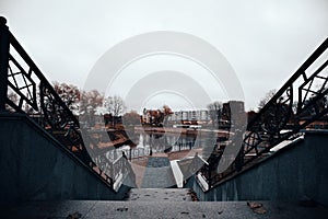 Autumn embankment with fallen leaves on  gloomy day