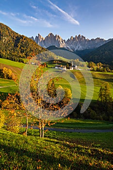 Autumn evening Santa Magdalena famous Italy Dolomites village view in front of the Geisler or Odle Dolomites mountain rocks