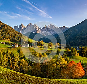 Autumn evening Santa Magdalena famous Italy Dolomites village view in front of the Geisler or Odle Dolomites mountain rocks