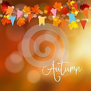 Autumn, fall background. Greeting card with maple and oak leaves and bokeh lights. String decoration with colorful party