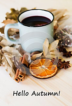 Autumn, fall leaves, hot steaming cup of glint wine