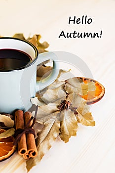 Autumn, fall leaves, hot steaming cup of glint wine