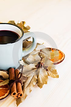 Autumn, fall leaves, hot steaming cup of glint wine