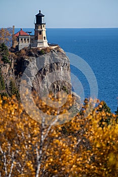 Autumn fall leaves with Split Rock Lighthouse in the distance on Lake Superior Minnesota