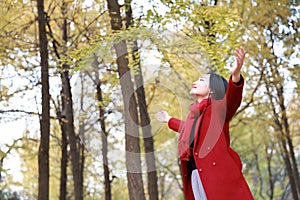 Autumn / fall woman happy in free freedom pose