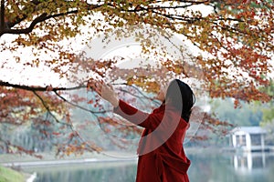 Autumn / fall woman happy in free freedom pose