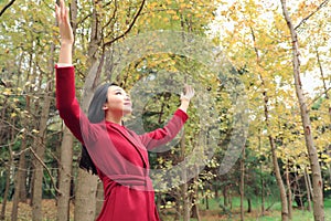 Autumn / fall woman happy in free freedom pose