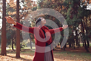 Autumn / fall woman happy in free freedom pose