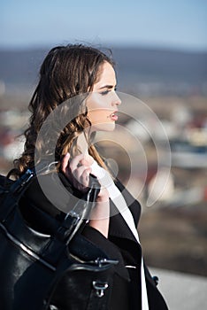 Autumn fashion of business woman with bag. Pretty girl with fashionable hair. Fashion woman with stylish makeup and