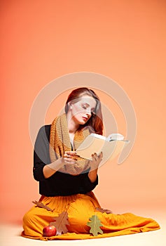 Autumn fashion girl with book orange eye-lashes