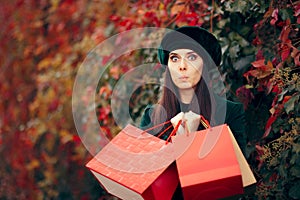 Autumn Fashion Girl with Shopping Bags Outdoors