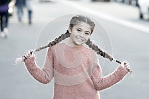 Autumn fashion for pretty girl. Happy childhood. Autumn snuggles. Small child with long hair. Casually beautiful. Happy