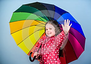 Autumn fashion. rain protection. Rainbow. cheerful hipster child in positive mood. happy small girl with colorful