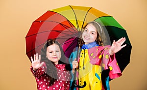 Autumn fashion. rain protection. Rainbow. cheerful hipster children, sisterhood. happy little girls with colorful