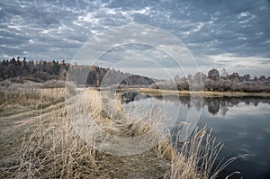 Autumn Field in frost. Dawn. River