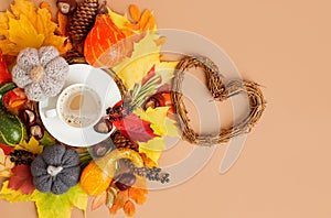 Autumn flat lay composition with dry leaves, coffee latte cup on neutral beige background. Creative autumn, thanksgiving, fall,