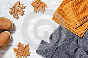 Autumn flat lay with warm clothing. Bright fashion clothes for womans