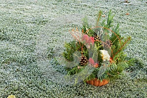 Autumn Floral Decorations In A Basket For A Grave For All Souls` Day On The Lawn