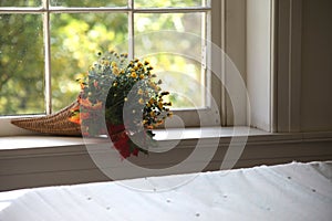 Autumn flower bouquet on interior window sill