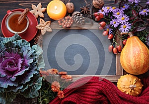 Autumn flowers with cup of tea