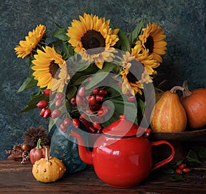 Autumn flowers with tea pot