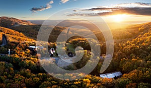 Autumn forest and fields in warm evening light, seen from the air, Slovakia - Pezinska Baba