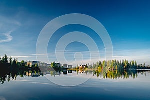 Autumn forest reflected in water. Colorful autumn morning in the mountains. Colourful autumn morning in mountain lake. Colorful