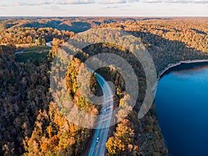 Autumn forests highway and river overlook by drone DJI mavic mini