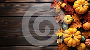 Autumn frame. Colorful maple leaves and pumpkins on wooden background. Flat lay, top view, copy space. Autumn fall, harvest,