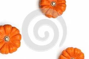 Autumn frame made of orange pumpkins isolated on white background. Fall, Halloween and Thanksgiving concept. Styled