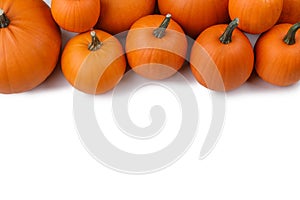 Autumn frame of pumpkins on white