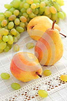 Autumn fruits pears and grapes still life