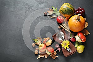 Autumn fruits, vegetables and cutlery on background, flat lay with space for text. Happy Thanksgiving day