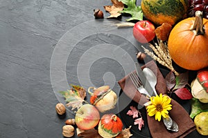 Autumn fruits, vegetables and cutlery on background, space for text. Happy Thanksgiving day