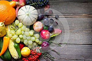 Autumn fruits and vegetables Still life on old wooden boards