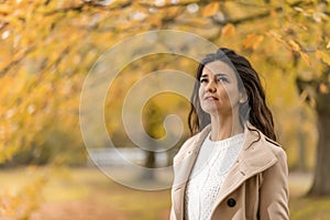 Autumn girl in the autumn trees forest