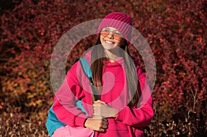 autumn girl carrying school bag. education for adolescence. teen girl in autumn park outdoor. autumn is a time to study