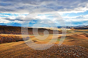 Autumn grassland and cloudscape