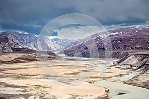 Autumn greenlandic wastelands landscape with lakes and mountains photo