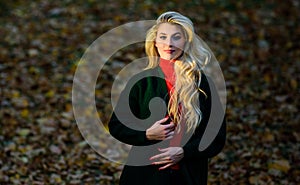 Autumn hair care important to avoid dry frizzy hairstyle. Girl gorgeous blonde autumn park. Long hair care concept. How