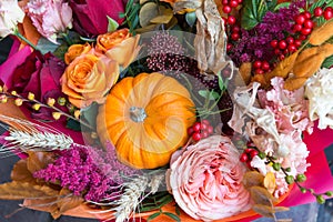 Autumn halloween bouquet with pumpkin close up. Flowers background