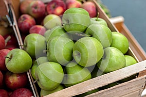 Autumn harvest of apples, sale of seasonal goods at the street fair.