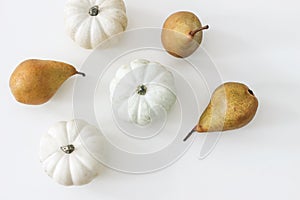 Autumn harvest pattern, web banner. Pear fruit and white pumpkins isolated on white table background. Fall, Thanksgiving