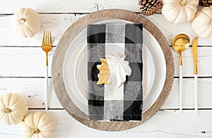 Autumn harvest or thanksgiving dinner table setting. Top view on a white wood background.