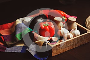 Autumn harvest vegetables, home growth onion and garlic picked up from farm in rustic tray