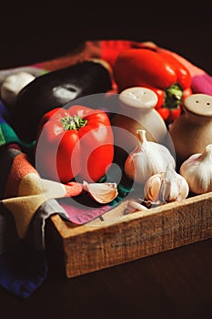 Autumn harvest vegetables, home growth onion and garlic picked up from farm in rustic tray