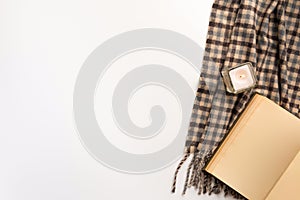 Autumn home cozy composition. Book and scarf, on white background