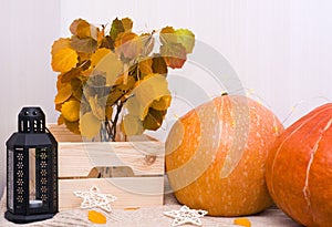 Autumn home decor. Autumn entourage of Pumpkins, candles, leaves. Blank for design. The idea of the interior.