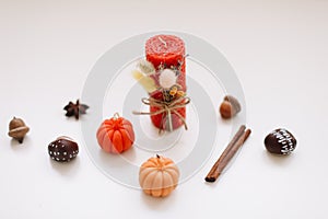 Autumn home decor with candles. Cozy fall composition. Happy thanksgiving concept.