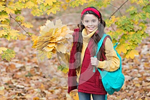 Autumn kid fashion. romantic season for inspiration. happy childhood. back to school. teenage girl with backpack hold